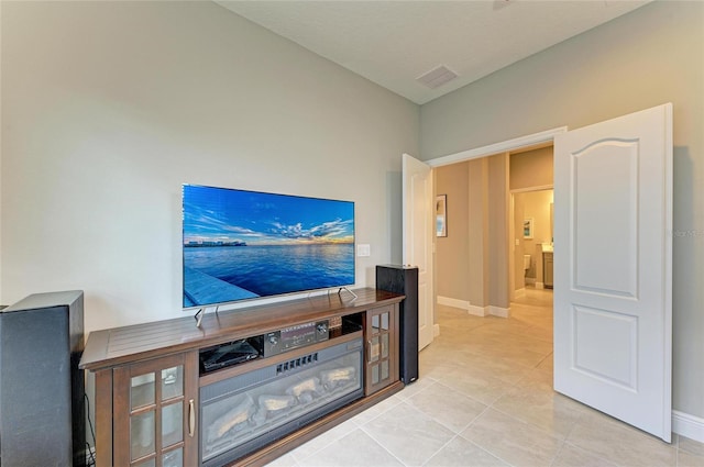 11685 Great Brook Ln, Parrish, FL 34219 - unfurnished living room with light tile patterned flooring and baseboards