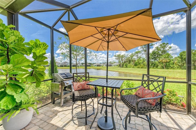 11685 Great Brook Ln, Parrish, FL 34219 - view of patio featuring a water view, area for grilling, glass enclosure, and view of wooded area