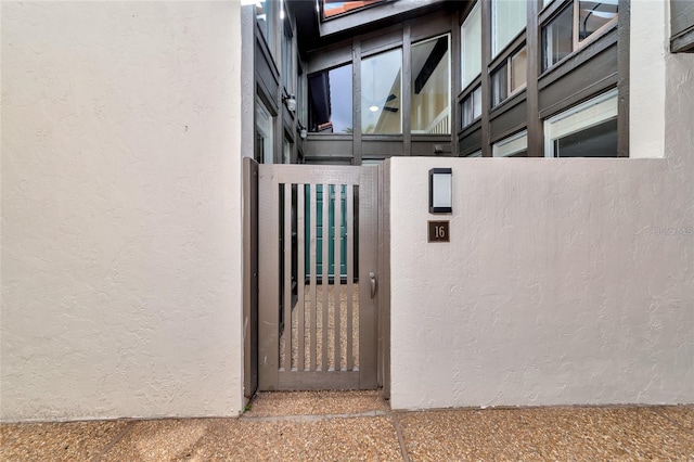 800 S Blvd Of The Presidents Unit 16, Sarasota, FL 34236 - doorway to property with a gate and stucco siding