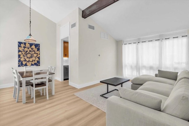 800 S Blvd Of The Presidents Unit 16, Sarasota, FL 34236 - living room featuring light wood-style flooring, beam ceiling, and high vaulted ceiling