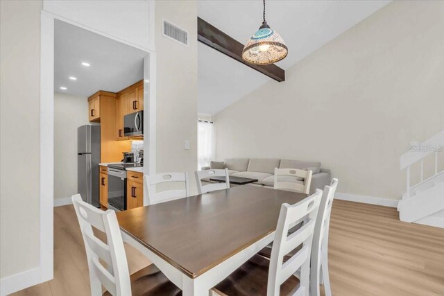 800 S Blvd Of The Presidents Unit 16, Sarasota, FL 34236 - dining area featuring light wood-style floors, beam ceiling, and recessed lighting
