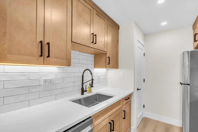 800 S Blvd Of The Presidents Unit 16, Sarasota, FL 34236 - kitchen with freestanding refrigerator, tasteful backsplash, light wood finished floors, light countertops, and recessed lighting