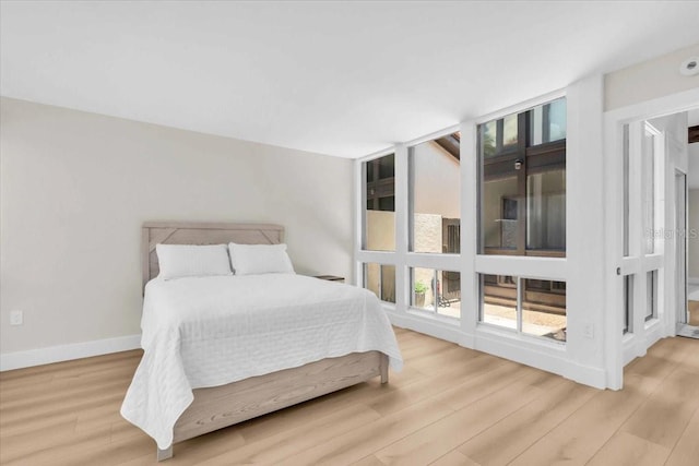 800 S Blvd Of The Presidents Unit 16, Sarasota, FL 34236 - bedroom with wood finished floors and baseboards