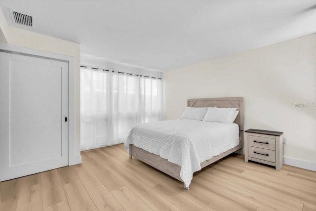 800 S Blvd Of The Presidents Unit 16, Sarasota, FL 34236 - bedroom featuring light wood finished floors and baseboards