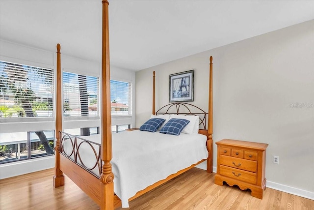 800 S Blvd Of The Presidents Unit 16, Sarasota, FL 34236 - bedroom with light wood finished floors and baseboards