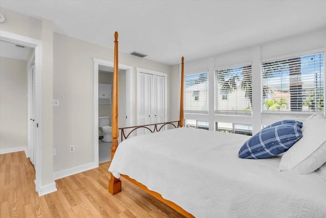 800 S Blvd Of The Presidents Unit 16, Sarasota, FL 34236 - bedroom featuring multiple windows, wood finished floors, and a closet