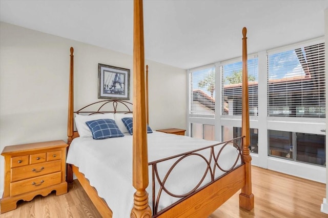 800 S Blvd Of The Presidents Unit 16, Sarasota, FL 34236 - bedroom with light wood finished floors