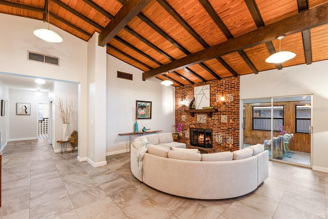 4232 Pandora Rd, Venice, FL 34293 - living room featuring a wooden ceiling with exposed beams, a fireplace, and high vaulted ceiling