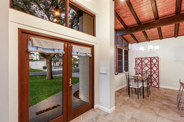 4232 Pandora Rd, Venice, FL 34293 - doorway to outside featuring a wooden ceiling with exposed beams, a chandelier, marble look tile flooring, high vaulted ceiling, and french doors