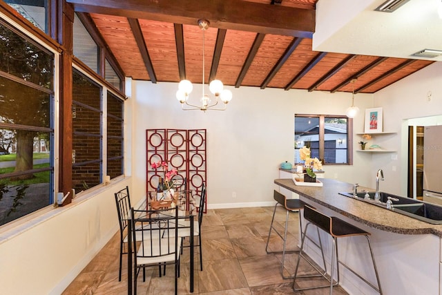 4232 Pandora Rd, Venice, FL 34293 - dining space with wood ceiling and a chandelier