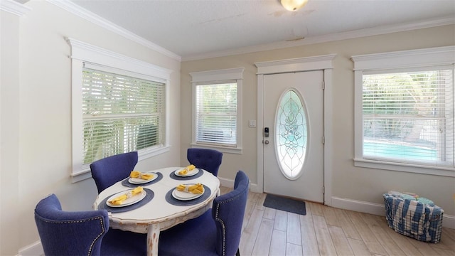152 Coolidge Dr, Sarasota, FL 34236 - foyer with plenty of natural light, light wood-type flooring, and ornamental molding