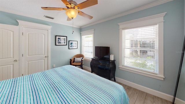 152 Coolidge Dr, Sarasota, FL 34236 - bedroom with light wood-type flooring, ornamental molding, and a ceiling fan