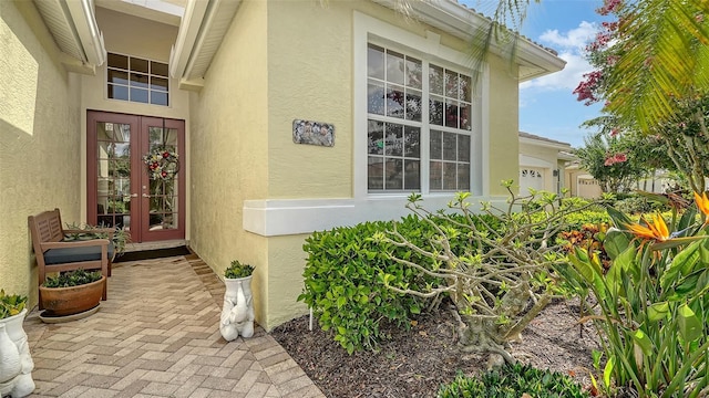 8183 Nice Way, Sarasota, FL 34238 - doorway to property featuring french doors and stucco siding