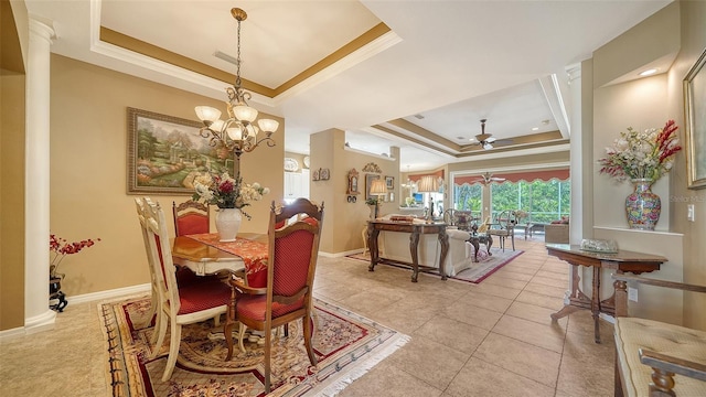 8183 Nice Way, Sarasota, FL 34238 - dining area with a raised ceiling, crown molding, ceiling fan, light tile patterned flooring, and a chandelier