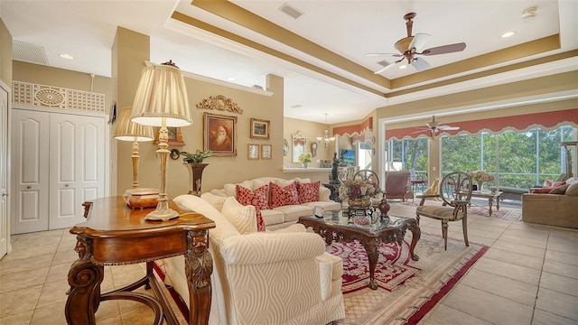8183 Nice Way, Sarasota, FL 34238 - living room featuring ceiling fan, light tile patterned flooring, a raised ceiling, crown molding, and recessed lighting