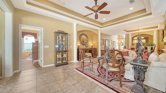 8183 Nice Way, Sarasota, FL 34238 - living area with a raised ceiling, a ceiling fan, arched walkways, decorative columns, and ornamental molding