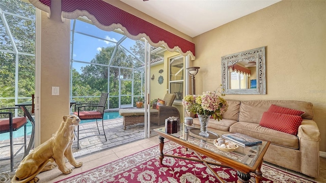 8183 Nice Way, Sarasota, FL 34238 - tiled living area featuring a textured wall and a sunroom