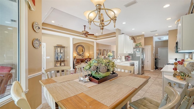 8183 Nice Way, Sarasota, FL 34238 - dining space featuring light tile patterned floors, ceiling fan, recessed lighting, ornate columns, and a chandelier