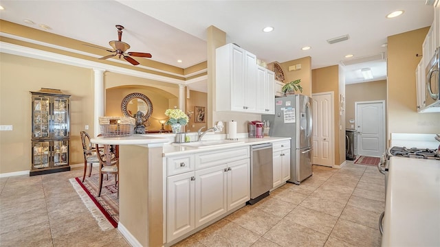 8183 Nice Way, Sarasota, FL 34238 - kitchen with appliances with stainless steel finishes, white cabinetry, light tile patterned floors, and recessed lighting