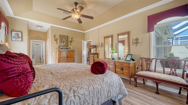 8183 Nice Way, Sarasota, FL 34238 - bedroom featuring wood finished floors, a tray ceiling, and ceiling fan