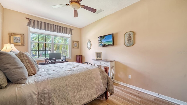 8183 Nice Way, Sarasota, FL 34238 - bedroom with wood finished floors and a ceiling fan