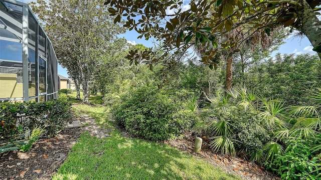 8183 Nice Way, Sarasota, FL 34238 - view of yard featuring a lanai