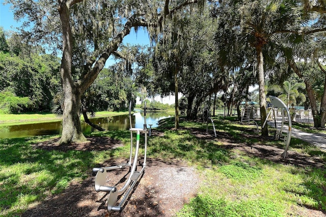 8183 Nice Way, Sarasota, FL 34238 - view of yard featuring a water view and view of wooded area
