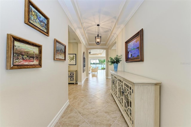 138 Toscavilla Blvd, Nokomis, FL 34275 - corridor featuring arched walkways, light tile patterned floors, ornamental molding, and a chandelier