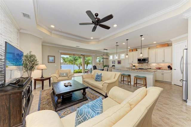 138 Toscavilla Blvd, Nokomis, FL 34275 - living area featuring plenty of natural light, ceiling fan, recessed lighting, crown molding, and light tile patterned floors