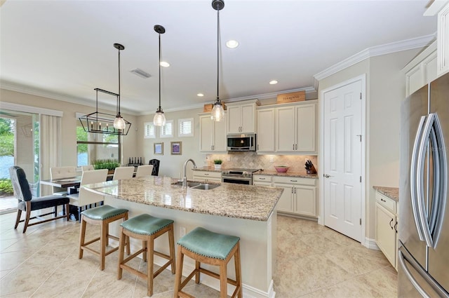 138 Toscavilla Blvd, Nokomis, FL 34275 - kitchen with appliances with stainless steel finishes, backsplash, ornamental molding, a breakfast bar, and pendant lighting