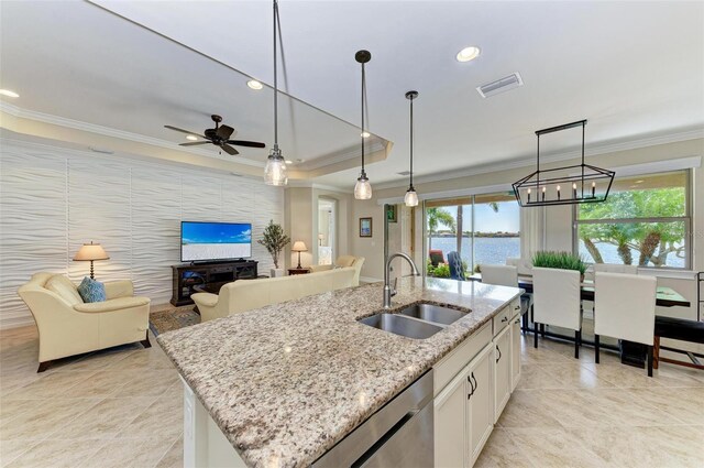 138 Toscavilla Blvd, Nokomis, FL 34275 - kitchen featuring ornamental molding, light tile patterned floors, stainless steel dishwasher, white cabinetry, and decorative light fixtures