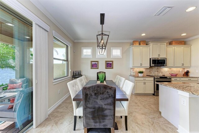 138 Toscavilla Blvd, Nokomis, FL 34275 - dining area featuring crown molding, light tile patterned floors, and recessed lighting