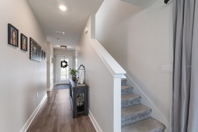 8985 Royal River Cir, Parrish, FL 34219 - corridor featuring dark wood-type flooring and stairway