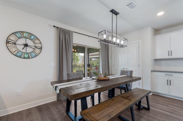 8985 Royal River Cir, Parrish, FL 34219 - dining room with dark wood-style floors, a chandelier, and recessed lighting
