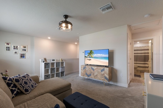 8985 Royal River Cir, Parrish, FL 34219 - living area featuring light colored carpet, attic access, and recessed lighting