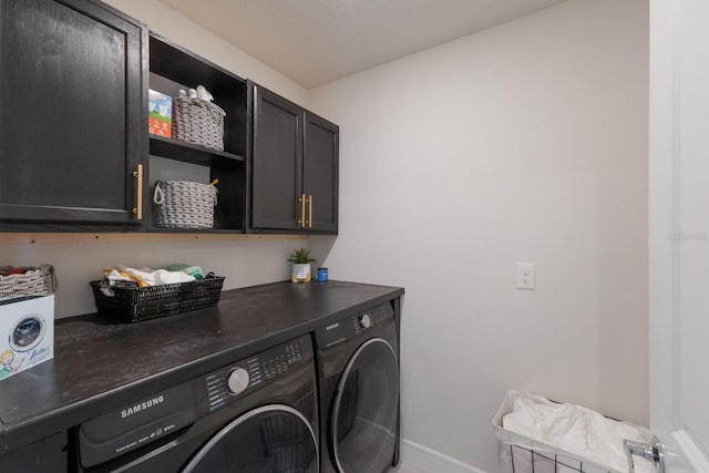 8985 Royal River Cir, Parrish, FL 34219 - laundry area with washing machine and clothes dryer and cabinet space