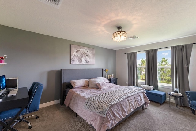 8985 Royal River Cir, Parrish, FL 34219 - carpeted bedroom with a desk and a textured ceiling