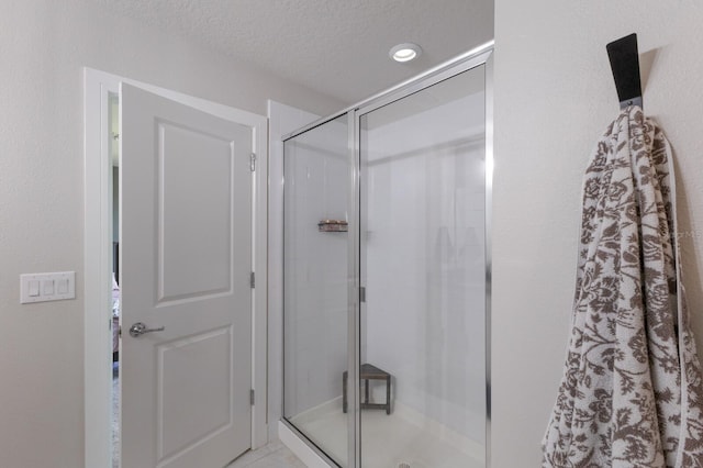 8985 Royal River Cir, Parrish, FL 34219 - full bathroom featuring a stall shower and a textured ceiling