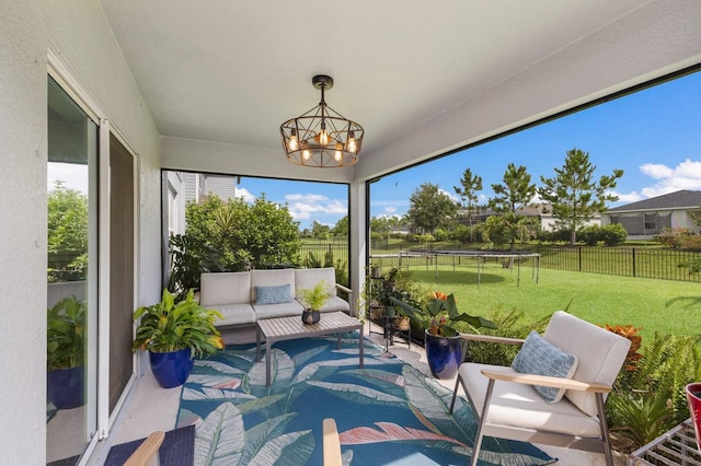8985 Royal River Cir, Parrish, FL 34219 - sunroom with an outdoor living space and a chandelier