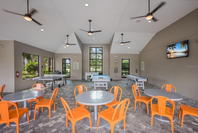 8985 Royal River Cir, Parrish, FL 34219 - carpeted dining room featuring billiards table, ceiling fan, and high vaulted ceiling