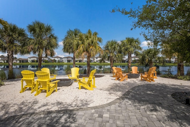 8985 Royal River Cir, Parrish, FL 34219 - surrounding community featuring an outdoor fire pit, a water view, and a residential view