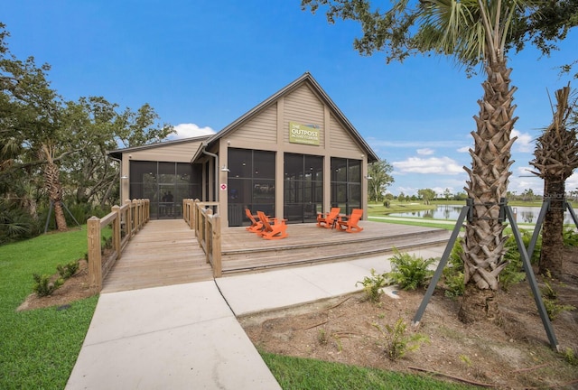 8985 Royal River Cir, Parrish, FL 34219 - view of front of home with a sunroom and a water view