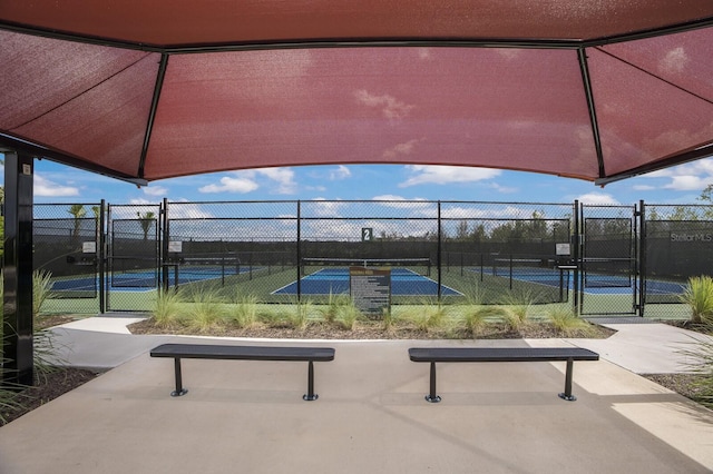 8985 Royal River Cir, Parrish, FL 34219 - view of community featuring a tennis court and a gate