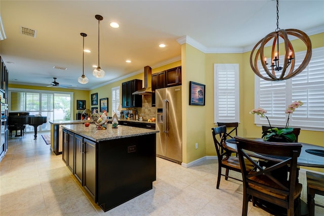 3681 Divot Ln, Sarasota, FL 34232 - kitchen with high end fridge, wall chimney range hood, ornamental molding, pendant lighting, and a center island