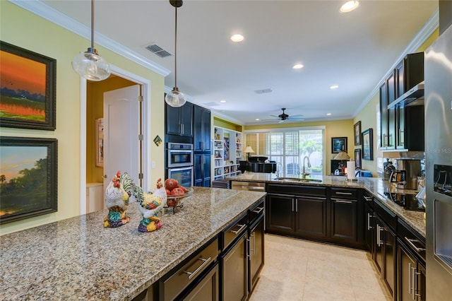 3681 Divot Ln, Sarasota, FL 34232 - kitchen featuring light stone counters, stainless steel appliances, recessed lighting, a peninsula, and ceiling fan