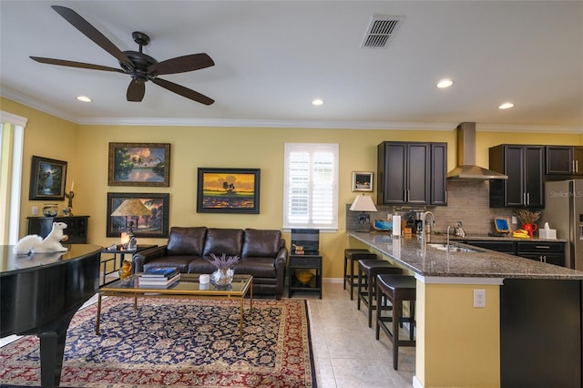 3681 Divot Ln, Sarasota, FL 34232 - living area featuring recessed lighting, a ceiling fan, ornamental molding, and light tile patterned floors
