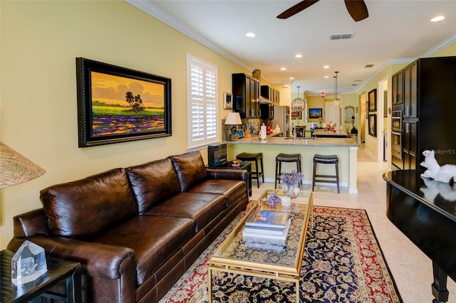 3681 Divot Ln, Sarasota, FL 34232 - living room with ornamental molding, a ceiling fan, light tile patterned flooring, and recessed lighting
