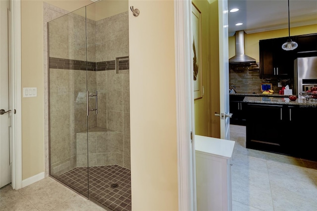 3681 Divot Ln, Sarasota, FL 34232 - bathroom with a shower stall, tile patterned floors, recessed lighting, vanity, and backsplash