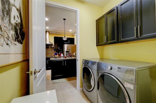3681 Divot Ln, Sarasota, FL 34232 - washroom with cabinet space, independent washer and dryer, light tile patterned flooring, and recessed lighting