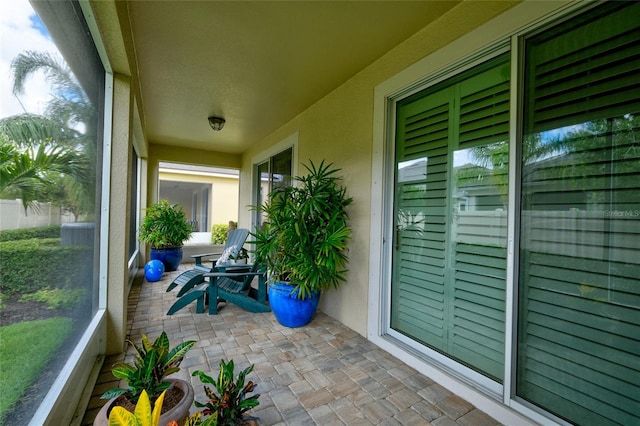 3681 Divot Ln, Sarasota, FL 34232 - sunroom / solarium with stone finish floors and plenty of natural light